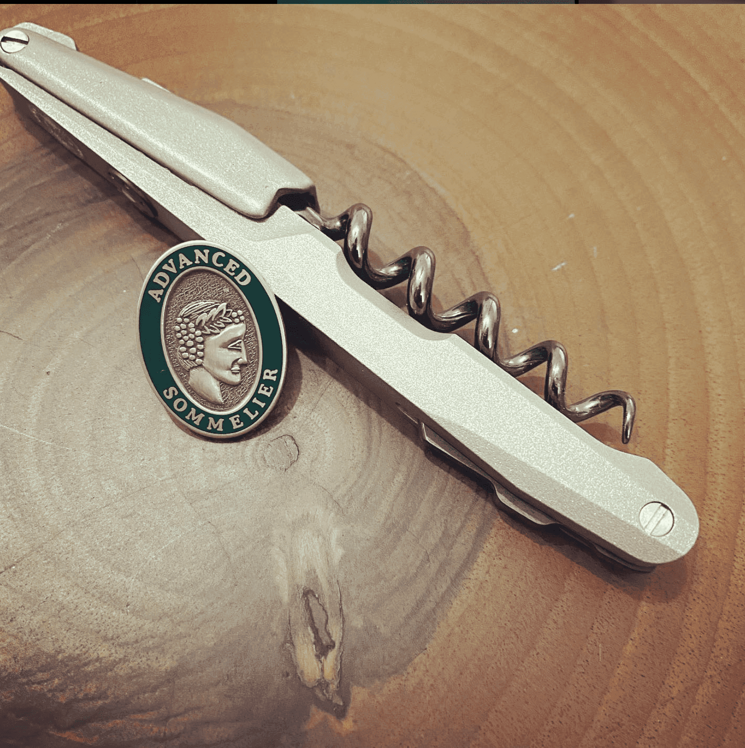 Alper Billik's Code38 wine key with his Advanced Sommelier pin